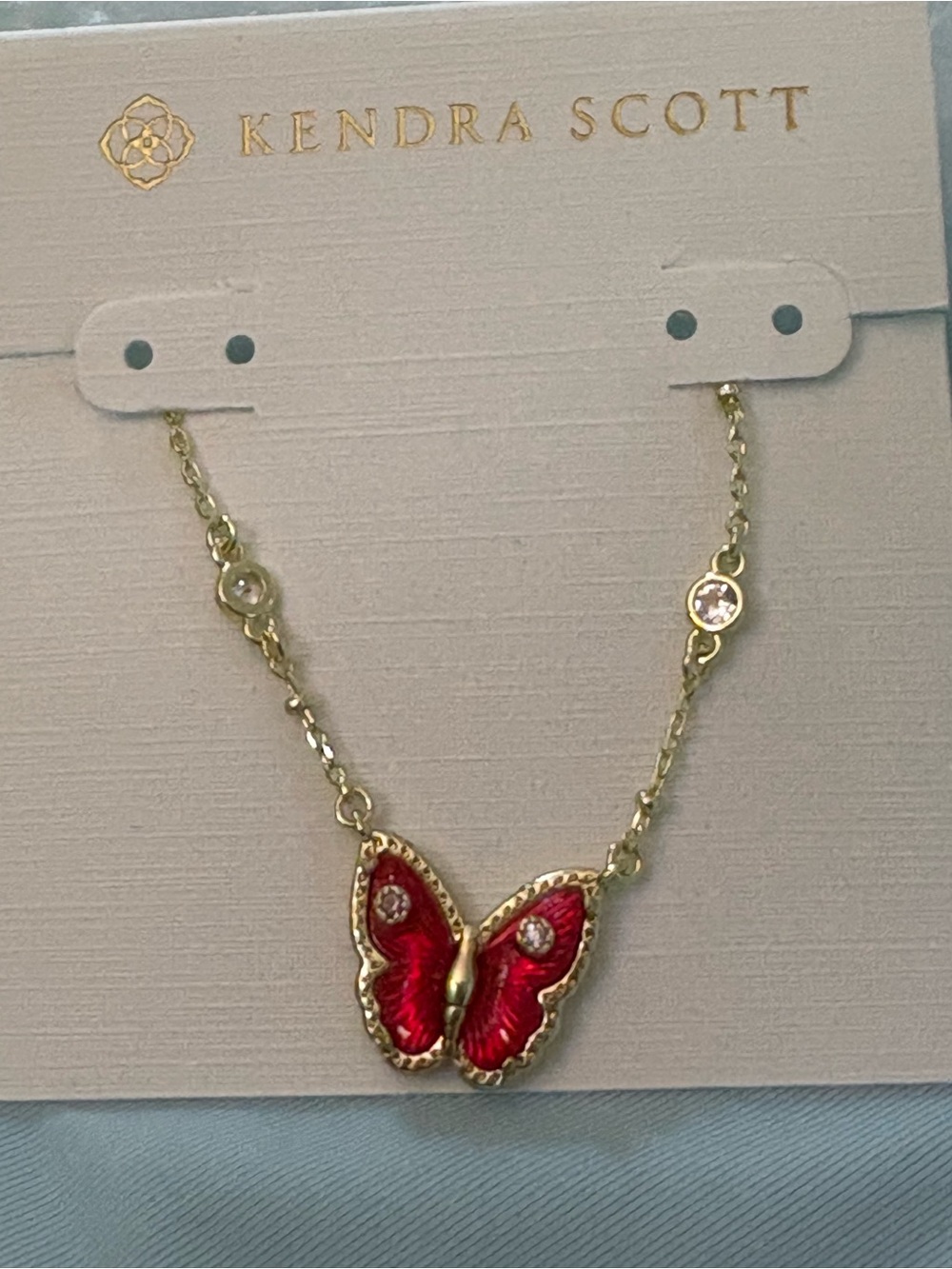 Kendra Scott Gold Necklace with Red Butterfly Pendant and Crystal Accents
